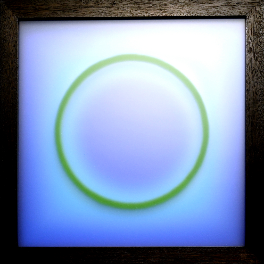 Dark blue image graduating to light blue, with a circle swimming in the middle distance.