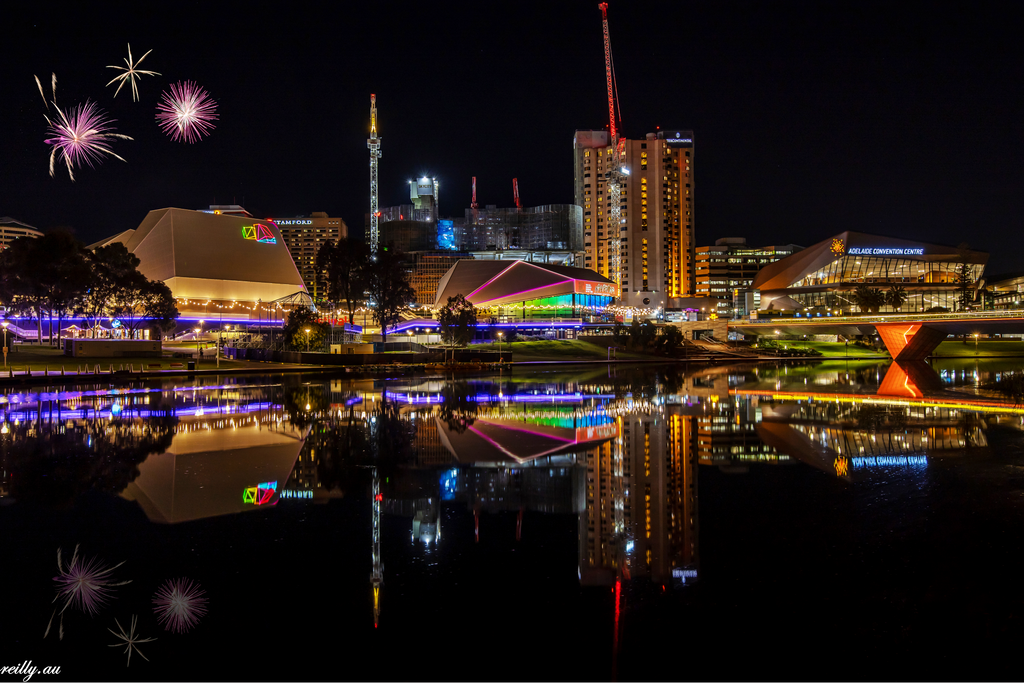 Adelaide at Night with Fireworks in the Sky. This is a composite image.