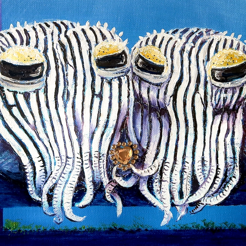 Pyjama squid holding a heart shaped jewellery