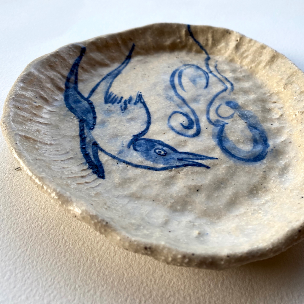 side plate with chirpy bird and clouds